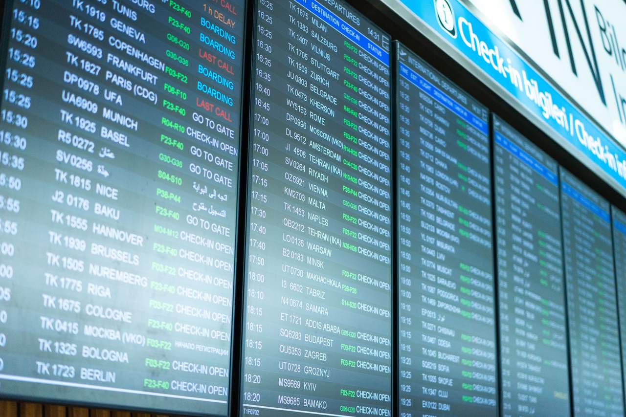 Departures board at a UK airport during the October half-term holiday