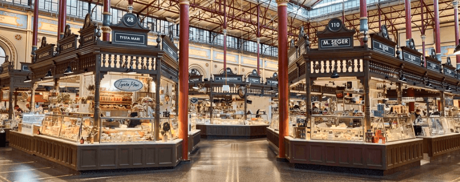 Inside Östermalm Food Hall with fresh seafood stalls and ornate architecture